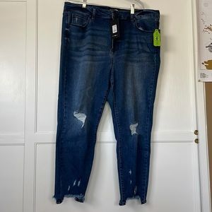Distressed dark denim jeans